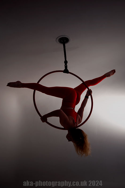 Aerial hoop. Shoulder stand split 
