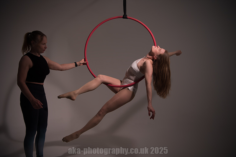 Bekki performing a single leg cradle pose.