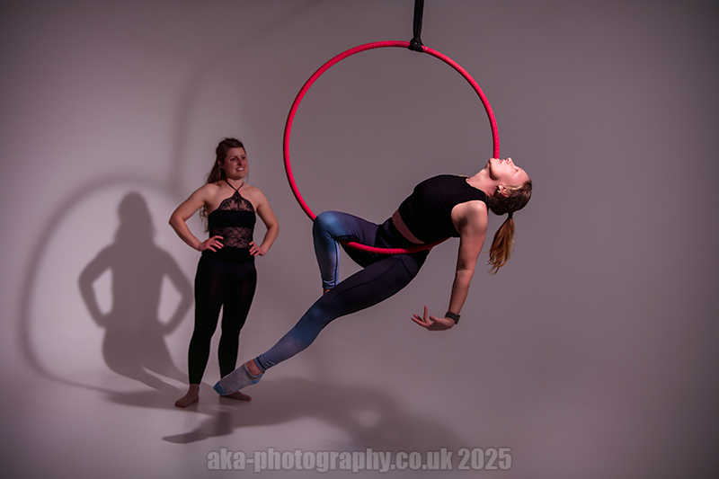 Here is me, demonstrating a pose. That's Melanie perfectly framed by the aerial hoop shadow.